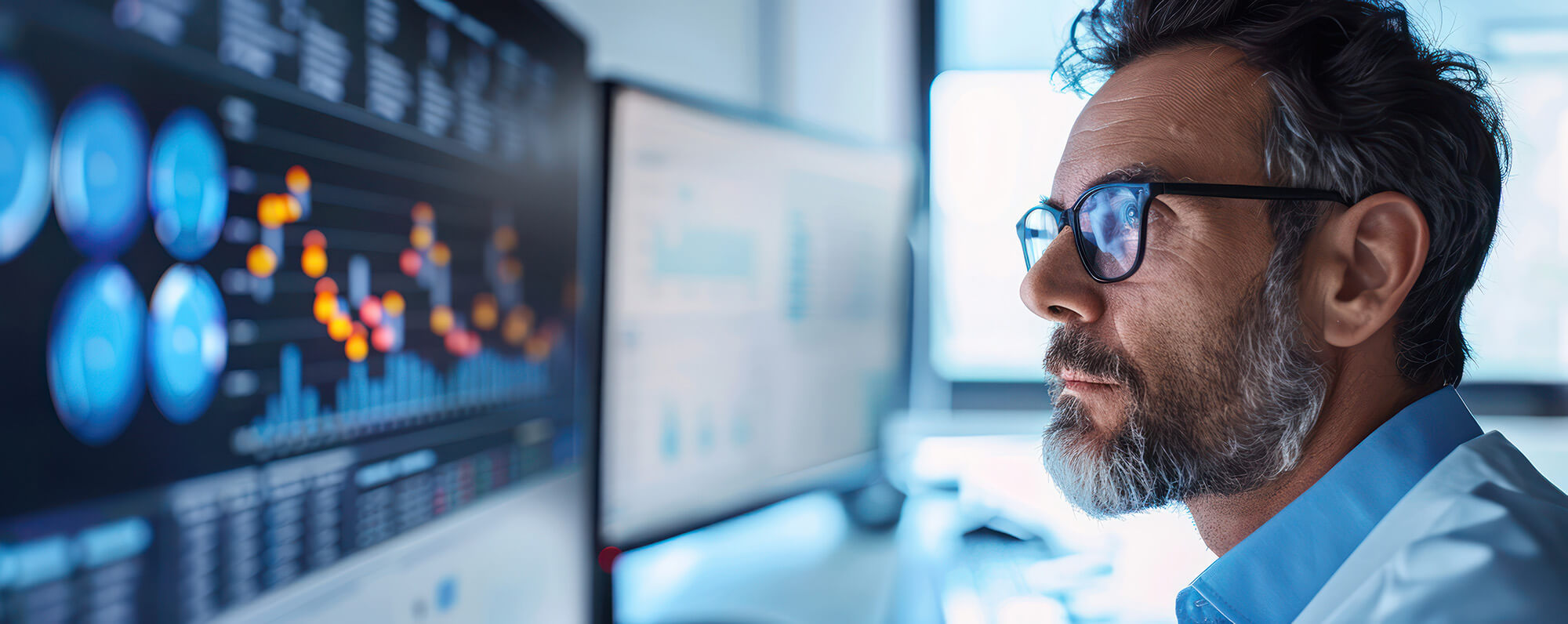 DataScientist Scientist in a white coat looking at monitors trying to analyze data.
