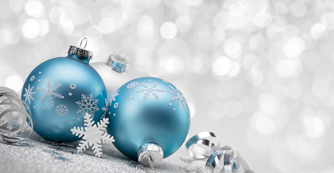 blue christmas balls in front of sparkling background